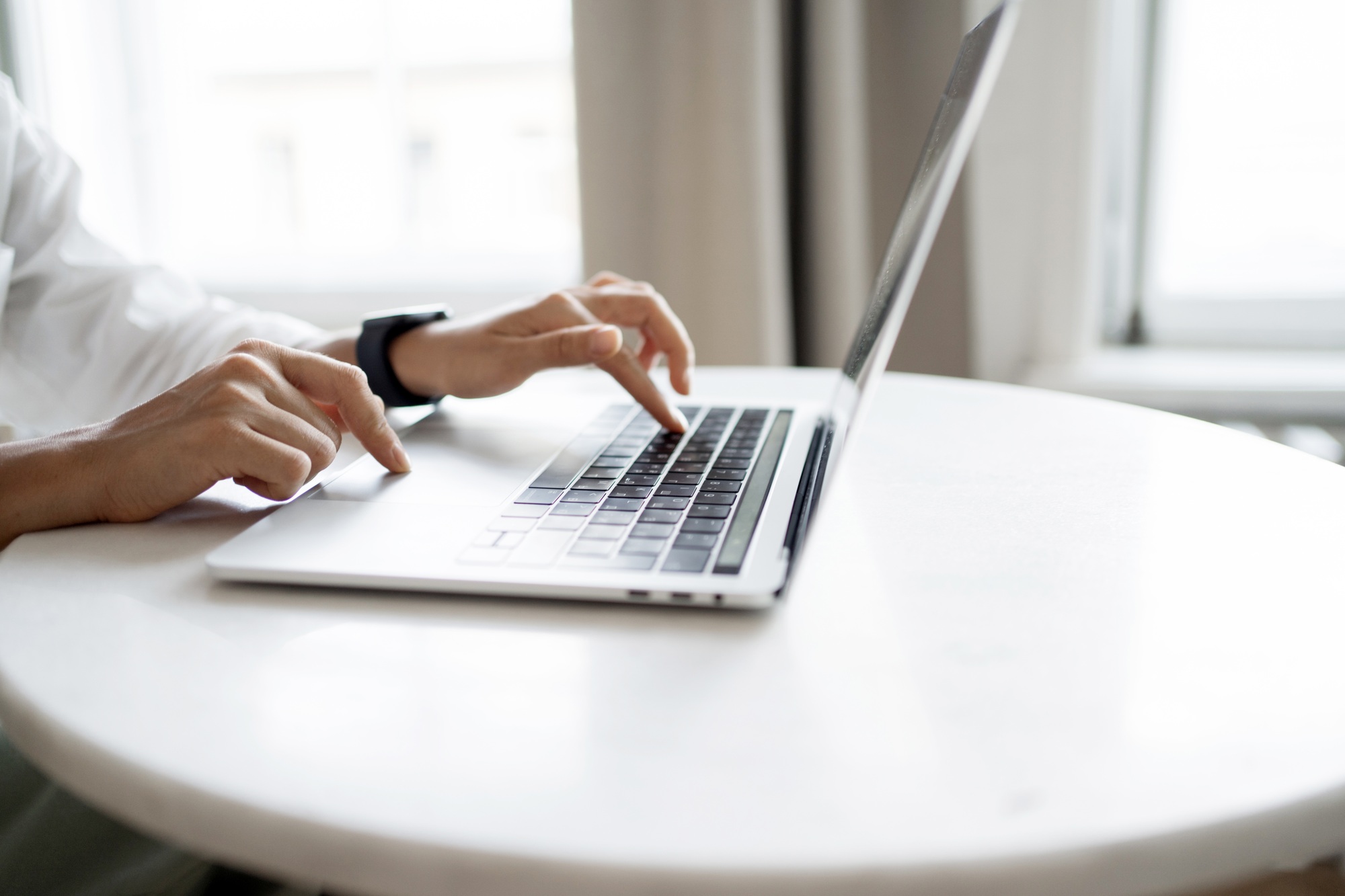 Woman online learning distance education on the website, laptop on the desk in the office